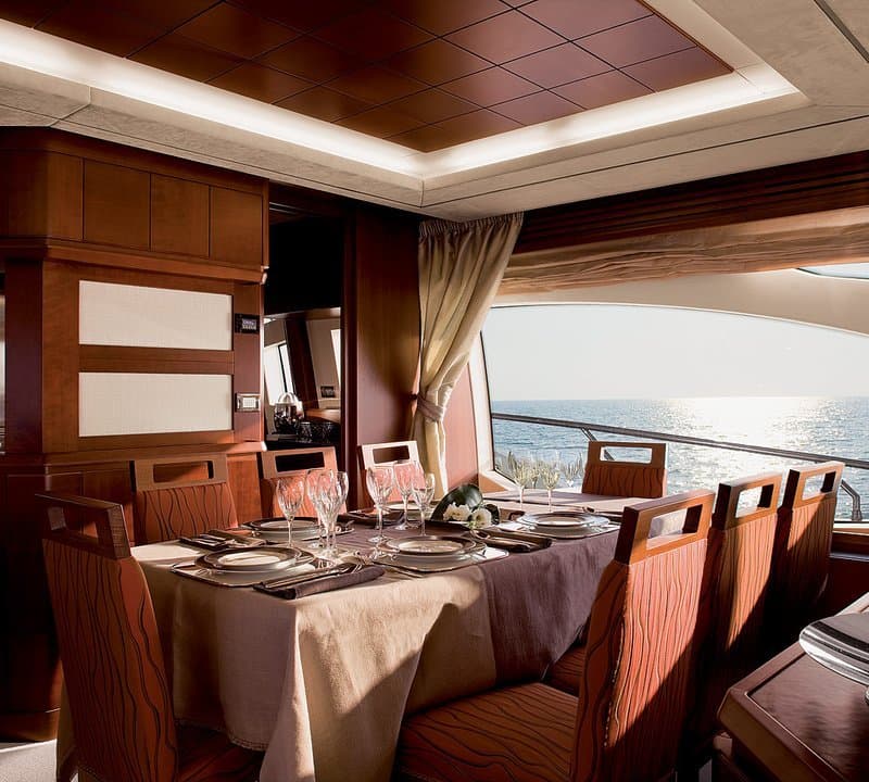 Andreika yacht formal dining salon aboard the 95ft Azimut charter in Cabo San Lucas