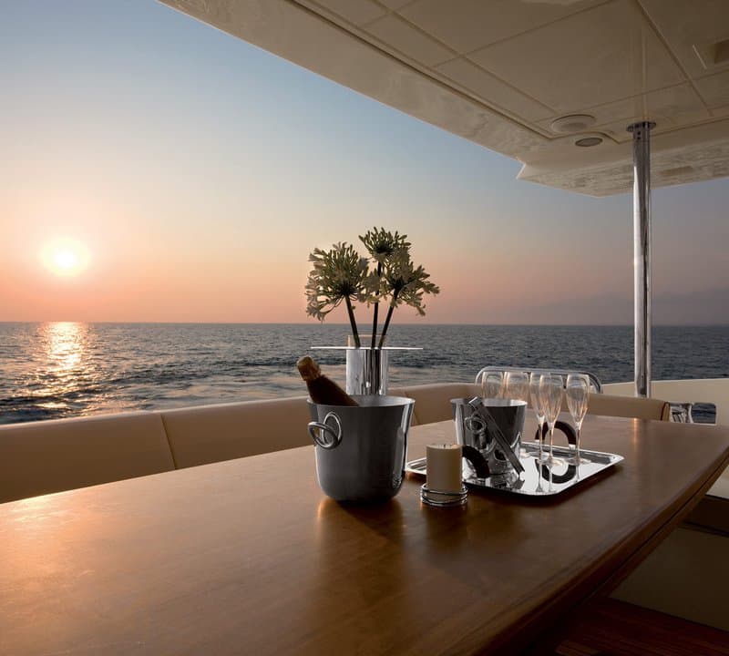 Andreika yacht sunset dining on the aft deck — 95ft charter in Cabo San Lucas